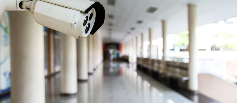 cctv security camera installed on school campus wall